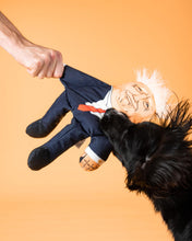 Load image into Gallery viewer, Donald Trump dog toy with black dog